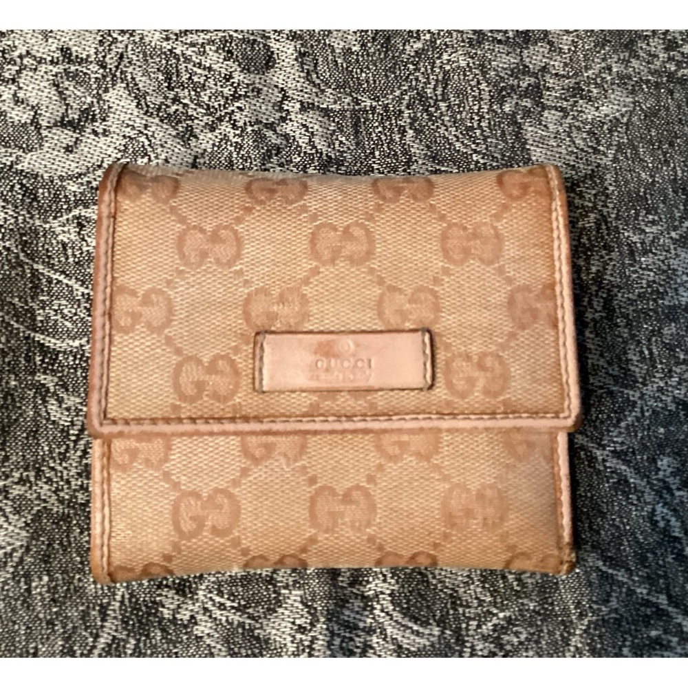 Authentic Gucci Monogram Trifold Wallet in pink and tan.
